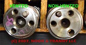 Vented optisparks have a deep centering hole in the camshaft and a longer dowel pin (left photo)